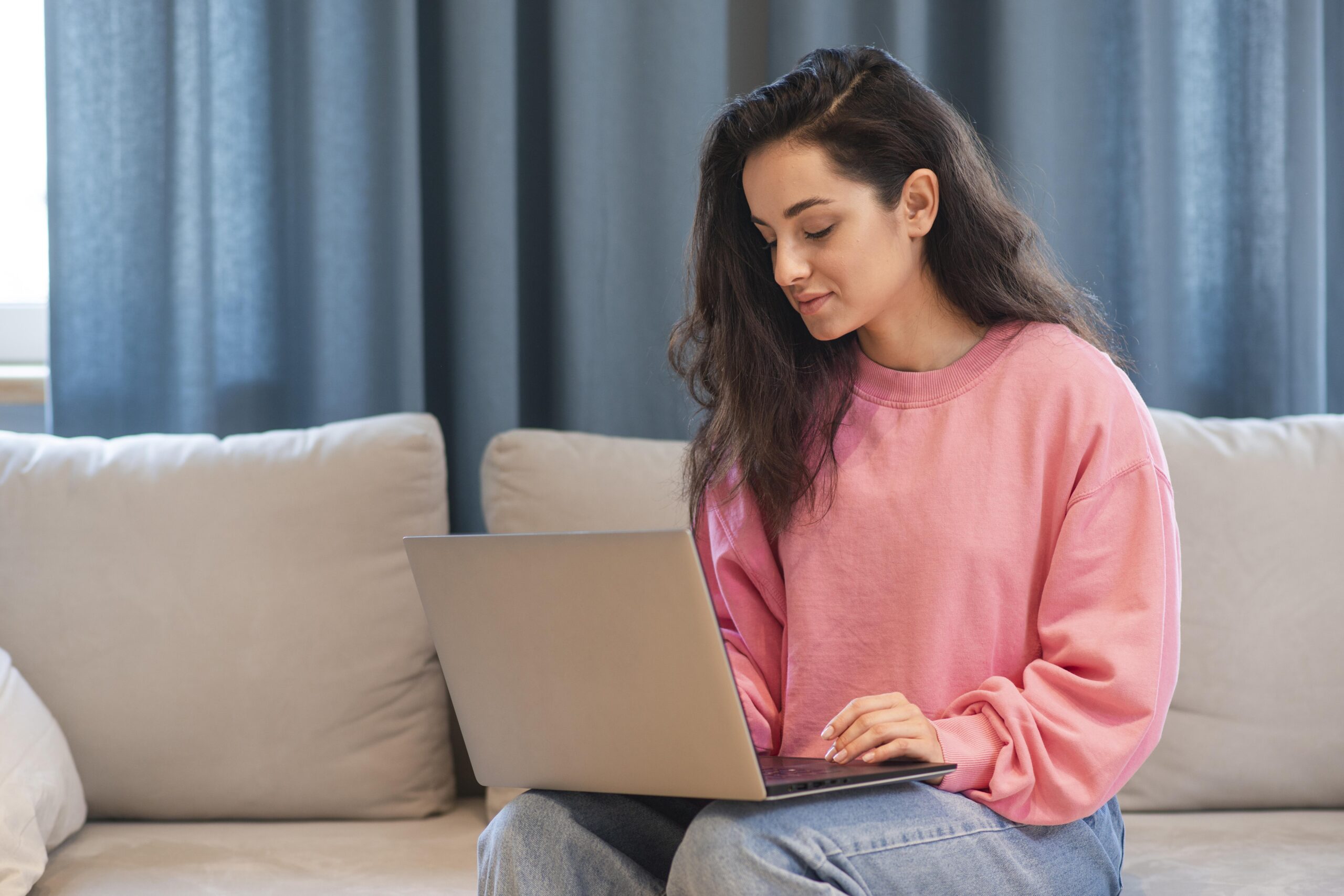 young-woman-working-laptop-home